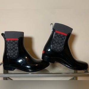 Coach rain boots woman’s size 6. Stylishly practical, black with red detailing.